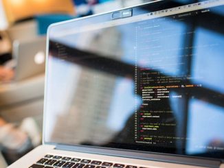 Software testing code on screen of black computer