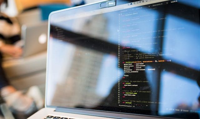 Software testing code on screen of black computer