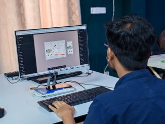 Software tester working on computer