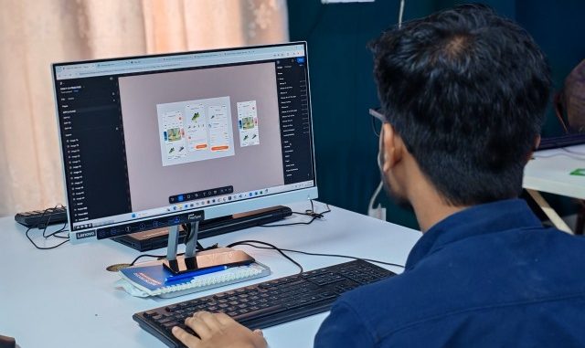 Software tester working on computer